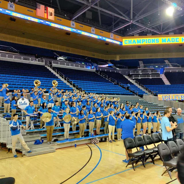 The UCLA marching band rehearsing inside Pauley Pavilion.