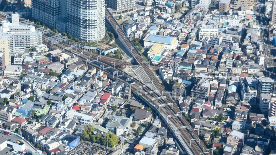 Rail lines running through dense Tokyo neighborhoods