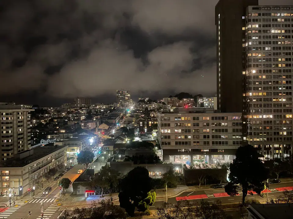 High-rise buildings and city streets at night.
